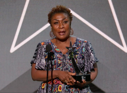 Burna Boy’s mom and manager receives his Best International Act Award. 